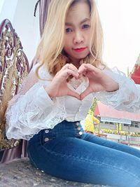 Portrait of happy girl sitting outdoors