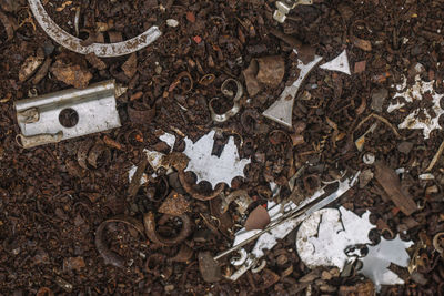 Directly above shot of scrap metals at junkyard