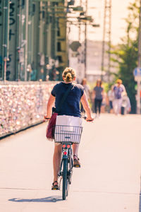 Man riding bicycle on city street