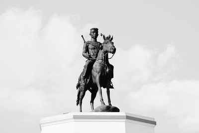 Low angle view of statue against sky