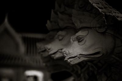 Low angle view of buddha statue at night