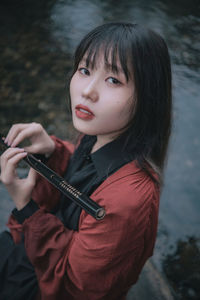 Portrait of young woman looking away