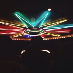 Low angle view of illuminated ferris wheel