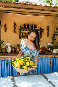 Portrait of a smiling young woman eating food