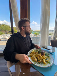 Portrait of man having food