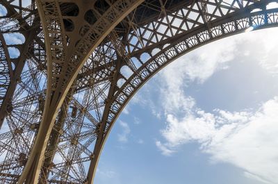 The curved detail of the wrought iron of the eiffel tower, paris