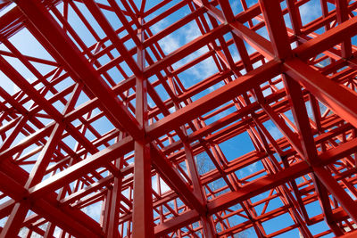 Low angle view of metallic structure against sky