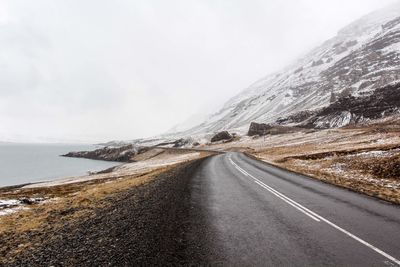 Road amidst landscape against sky