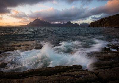 Scenic view of sea against cloudy sky