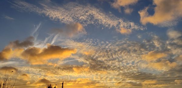 Low angle view of dramatic sky during sunset