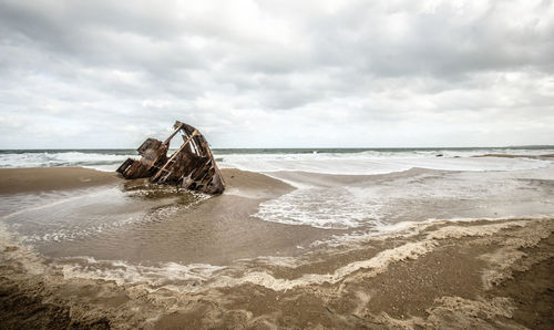 Scenic view of beach against sky