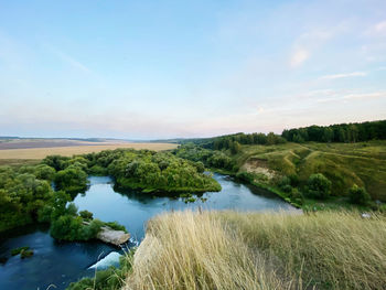 Scenic view of river against sky