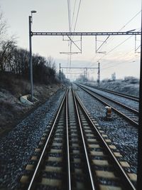 Surface level of railroad tracks against sky