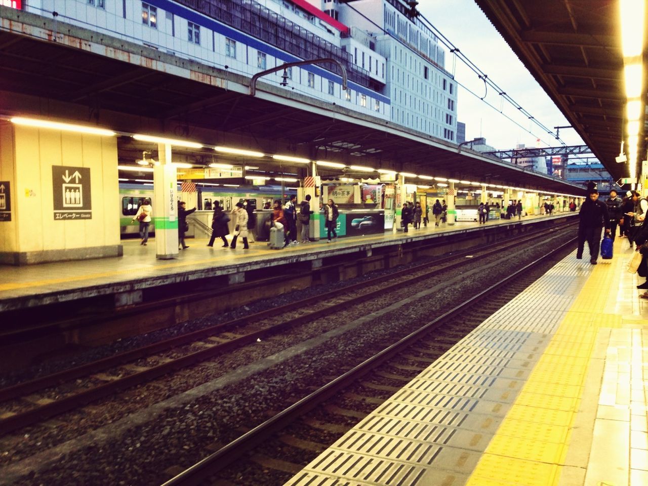 railroad track, railroad station, railroad station platform, public transportation, rail transportation, transportation, train - vehicle, travel, passenger train, men, passenger, public transport, person, railway station, subway station, large group of people, train, station, journey