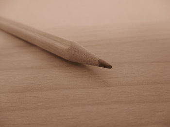 Close-up of pencil on wooden table