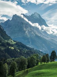 Cloudy scenic morning view of mättenberg mountain against the sky in grindelwald, switzerland