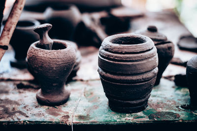 Close up of earthenware on table at workshop