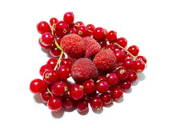 Close-up of raspberries against white background