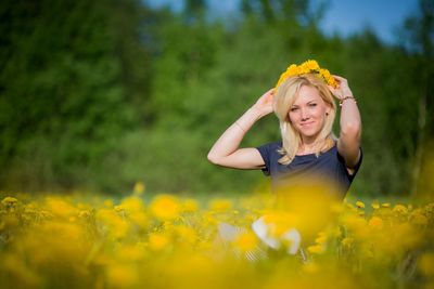 Young woman with yellow flower