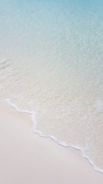 High angle view of surf on beach