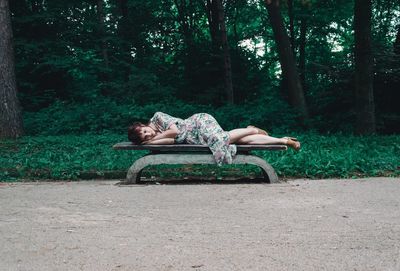 Boy sleeping on the ground