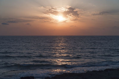 Scenic view of sea against sky during sunset