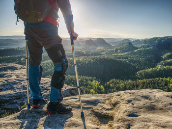 Knee joint hurt within trek. tourist man suffering from knee pain in mountain hike.