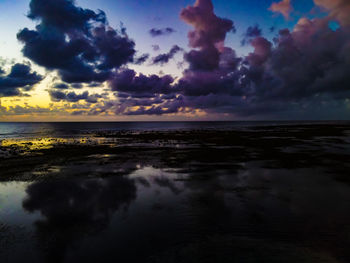 Scenic view of sea against sky at sunset