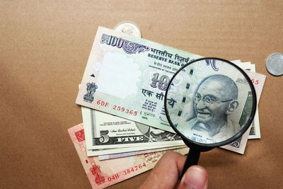 Close-up of hand holding paper