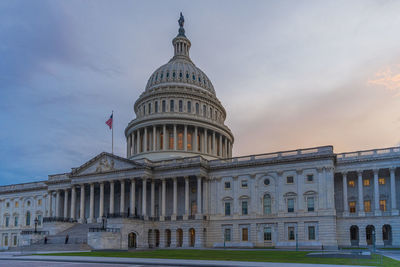 Low angle view of building against cloudy sky