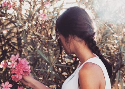 Woman plucking flowers