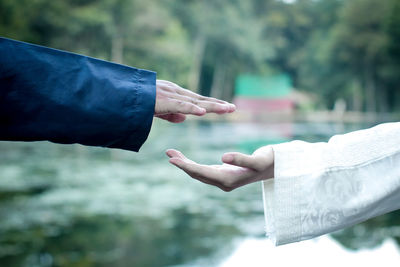 Cropped hand of woman holding hands