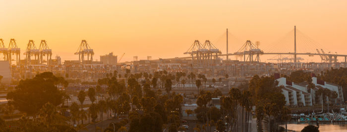 Cityscape against sky during sunset