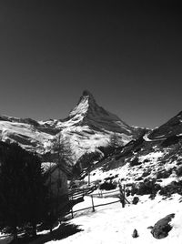 Scenic view of snow covered mountains