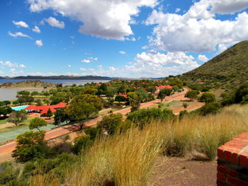 Scenic view of landscape against cloudy sky