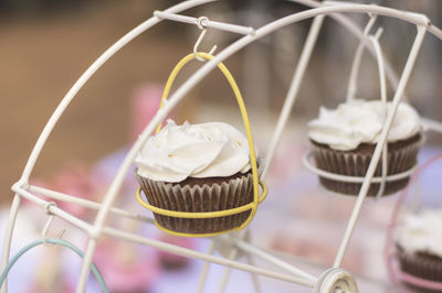 Close-up of cupcakes in stand on table
