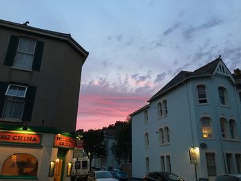 Cars in parking lot at sunset