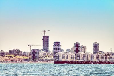 View of city skyline against clear sky