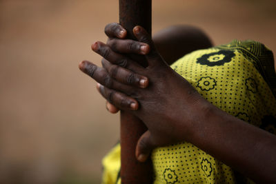 Close-up of man holding hand