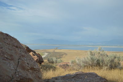 Scenic view of sea against cloudy sky