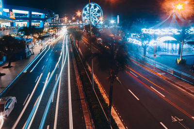 Light trails on road in city at night