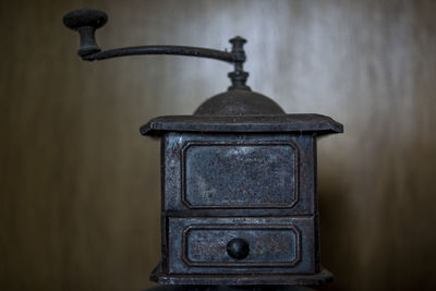 Close-up of old electric lamp on table