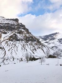 Scenic view of snowcapped mountains against sky