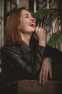 Young woman looking away outdoors