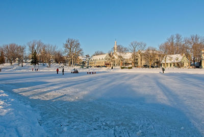 Skating on a frozen pond on a nice sunny day