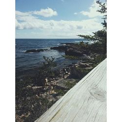 Scenic view of sea against cloudy sky