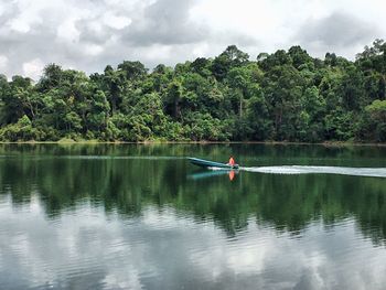 Boat in lake against sky