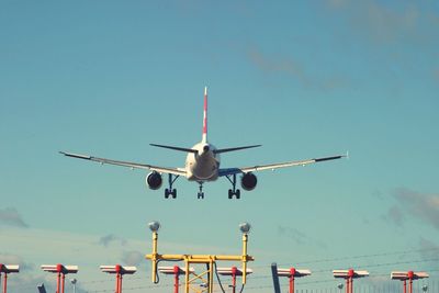 Low angle view of airplane flying in sky