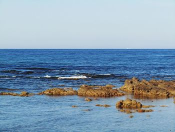 Scenic view of sea against clear sky