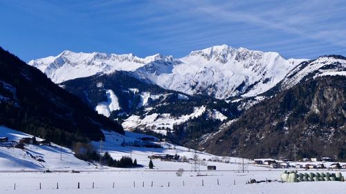 Scenic view of snowcapped mountains against sky